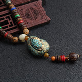 2019 New Round Plate Nepal Flower Pendant Ethnic Necklace Egypt Elephant Necklace Coconut Beads Necklace Sweater Necklaces